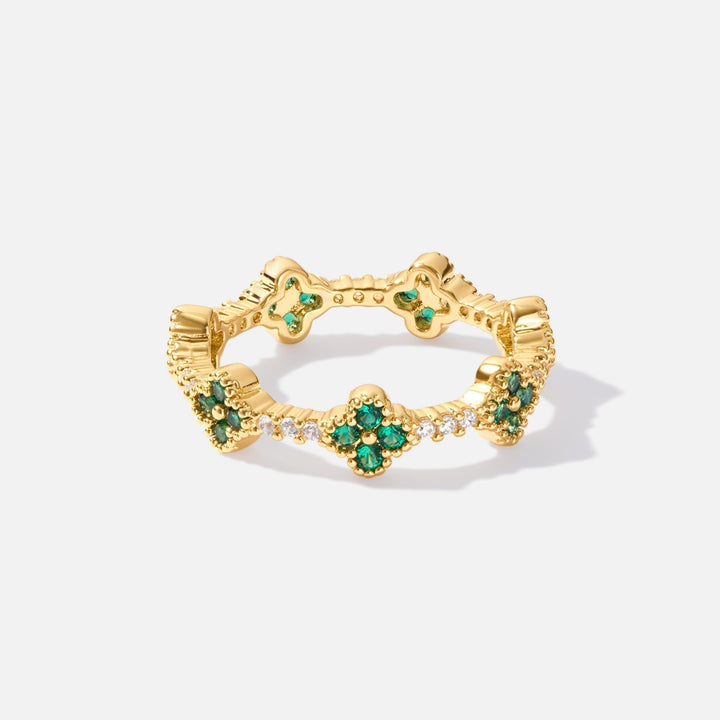 Annika – Goldring mit floralen Details und Smaragdelement.